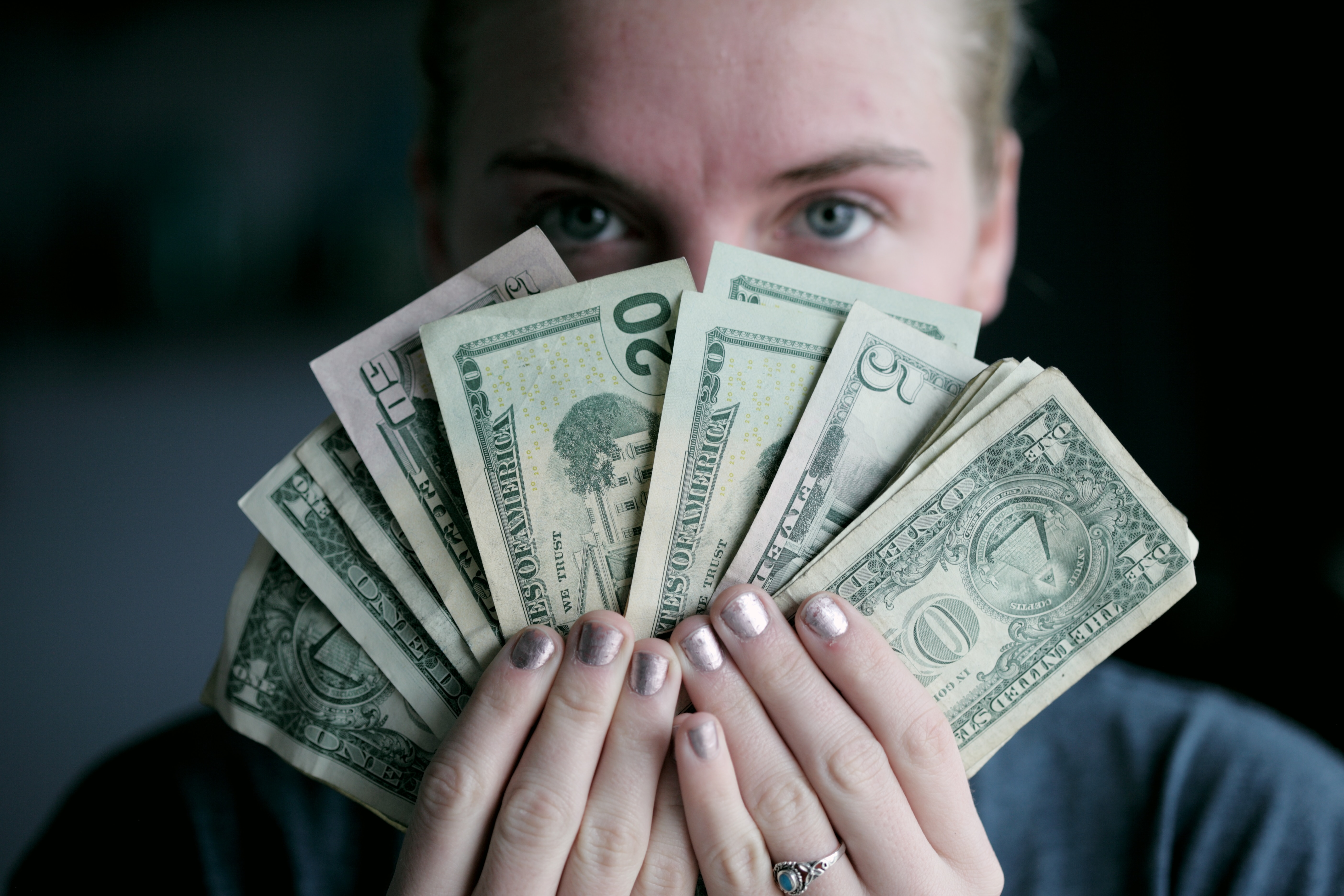 young woman holding money